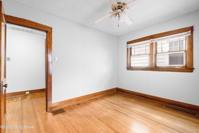 unfurnished room with hardwood / wood-style floors, a textured ceiling, and ceiling fan