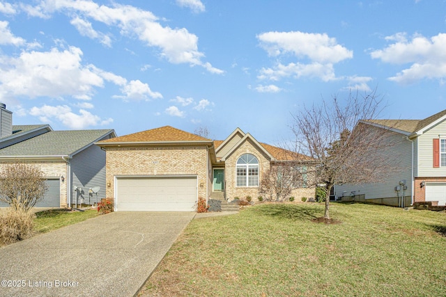 view of front of house with a garage and a front lawn