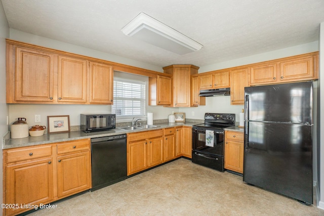 kitchen featuring sink and black appliances