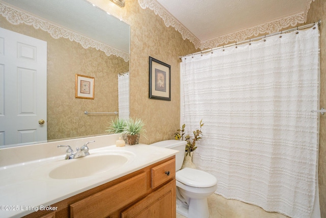 bathroom featuring vanity, tile patterned floors, a textured ceiling, and toilet