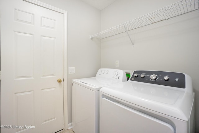 laundry room with separate washer and dryer