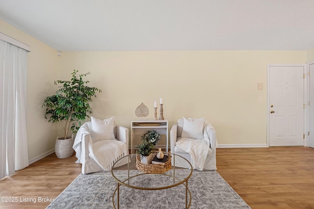 sitting room with light wood finished floors and baseboards