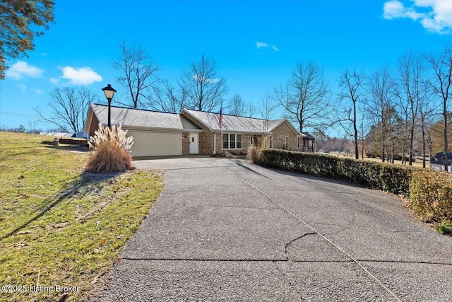 ranch-style house featuring a garage