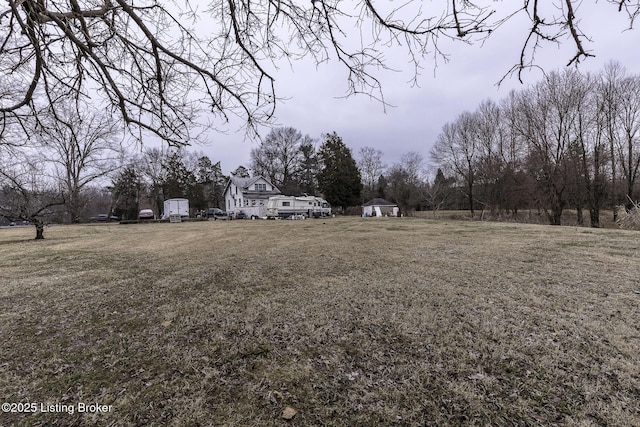 view of yard with a shed and an outdoor structure