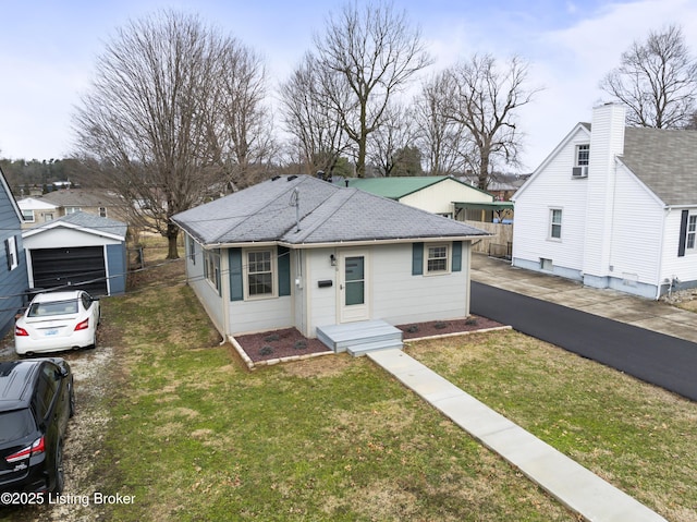 view of front of house with a garage and a front yard