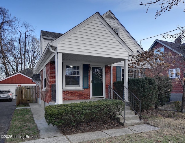 bungalow-style home featuring an outbuilding and a garage