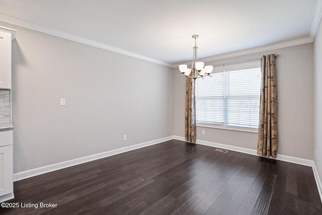 unfurnished dining area with ornamental molding, dark wood-type flooring, and an inviting chandelier