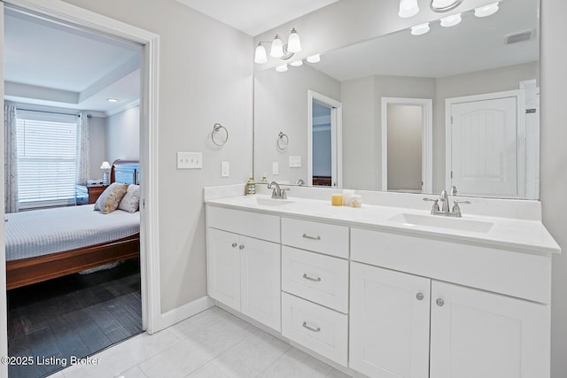 bathroom with vanity and tile patterned floors