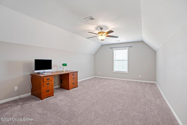 unfurnished office with vaulted ceiling, light carpet, and ceiling fan