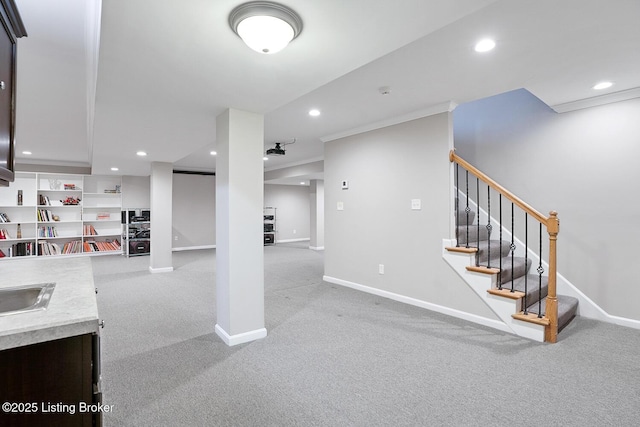 interior space featuring crown molding and sink