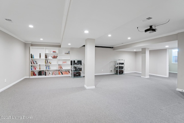 basement featuring ornamental molding and carpet