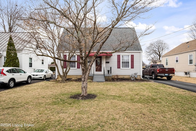 bungalow-style house with a front lawn