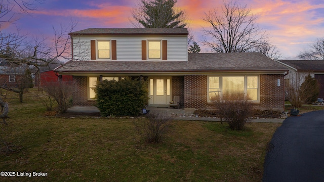 view of front property with a yard