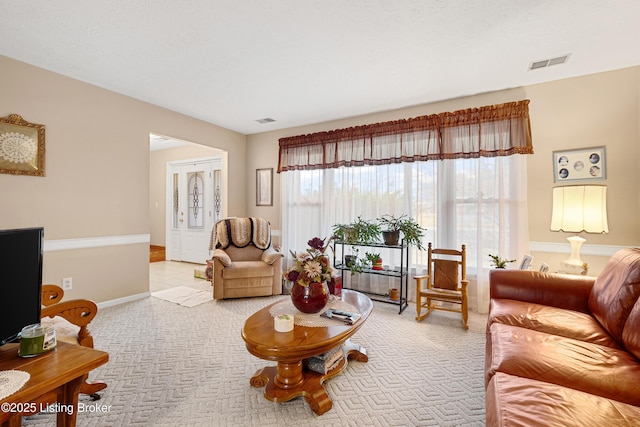 living room featuring light carpet