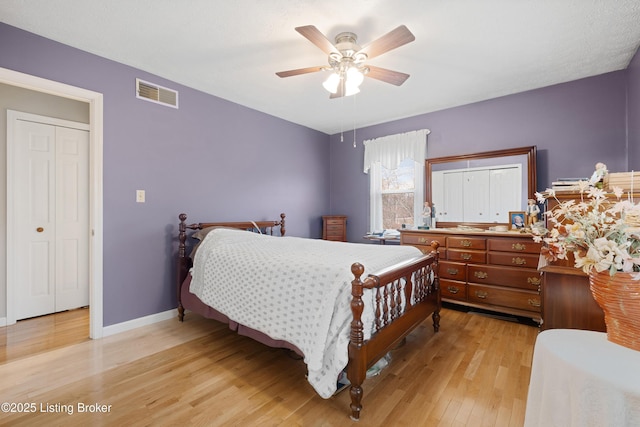 bedroom featuring light hardwood / wood-style floors and ceiling fan