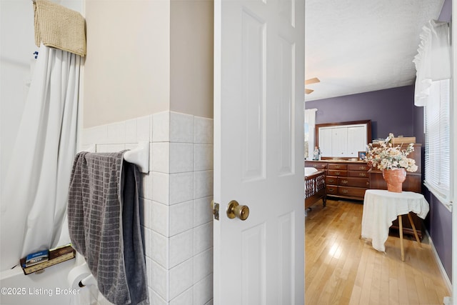 bathroom with hardwood / wood-style floors