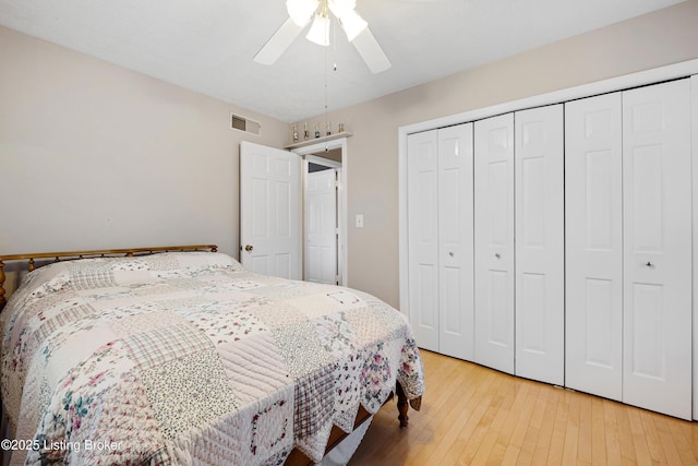 bedroom featuring a closet, hardwood / wood-style flooring, and ceiling fan