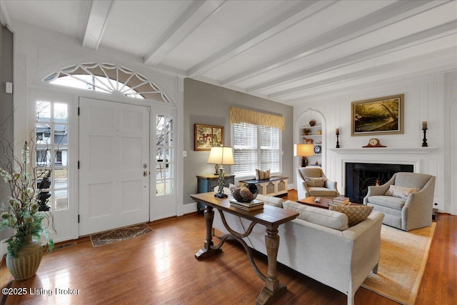 foyer with beam ceiling and hardwood / wood-style flooring