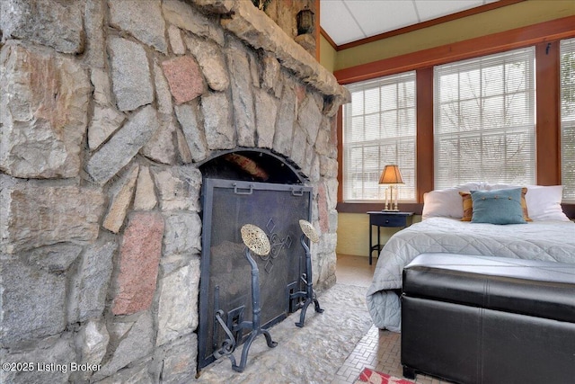 bedroom featuring a fireplace