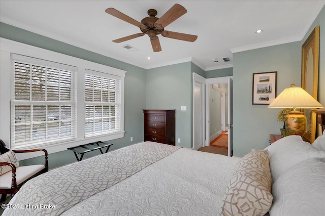 bedroom with crown molding and ceiling fan