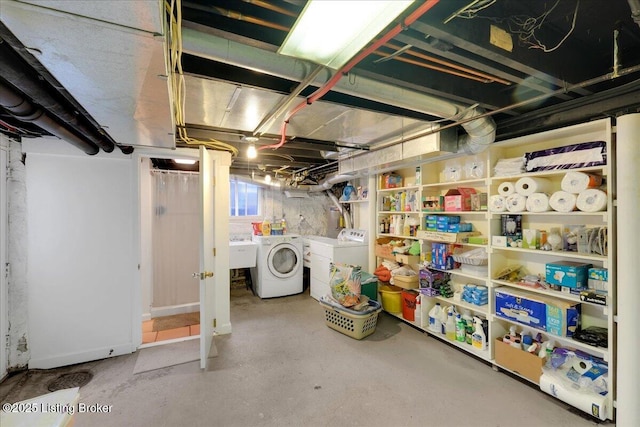 basement featuring sink and washing machine and clothes dryer