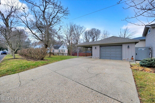 view of home's exterior featuring a garage and a lawn