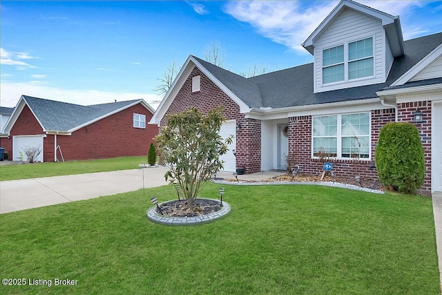 view of front facade featuring a garage, driveway, brick siding, and a front lawn