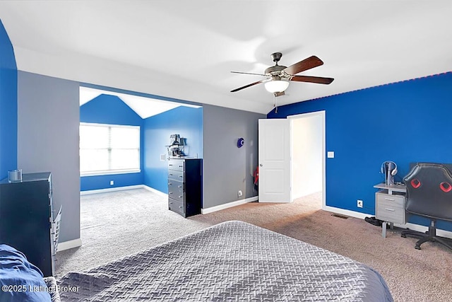 carpeted bedroom featuring lofted ceiling, ceiling fan, visible vents, and baseboards