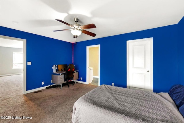 carpeted bedroom with baseboards, visible vents, and ceiling fan