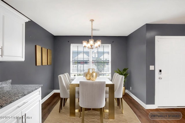 dining area featuring a chandelier, visible vents, baseboards, and dark wood-style floors