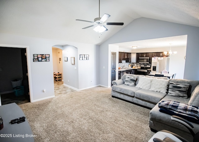 living room featuring light carpet, ceiling fan with notable chandelier, and high vaulted ceiling