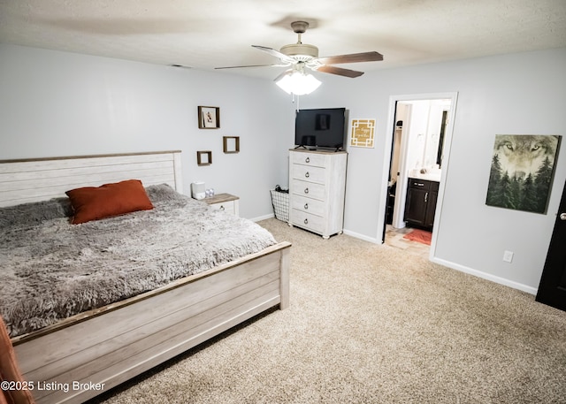 bedroom with carpet, ceiling fan, and ensuite bath