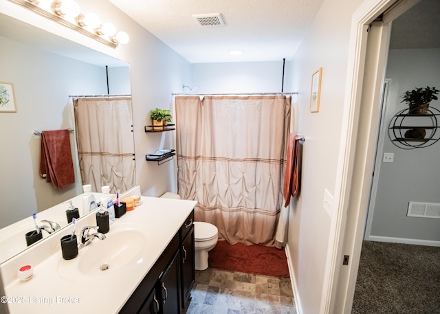 full bathroom featuring shower / bath combination with curtain, vanity, and toilet