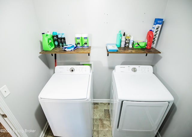 laundry area featuring washing machine and clothes dryer