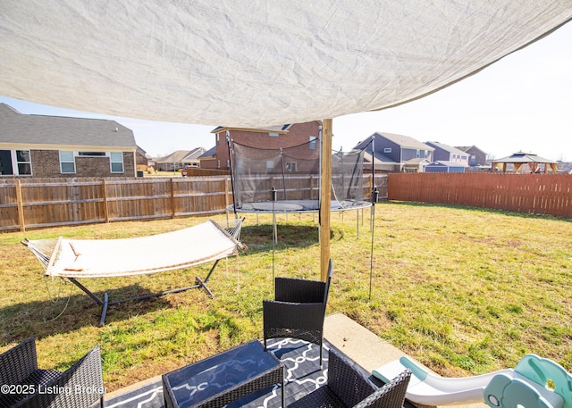 view of yard with a trampoline