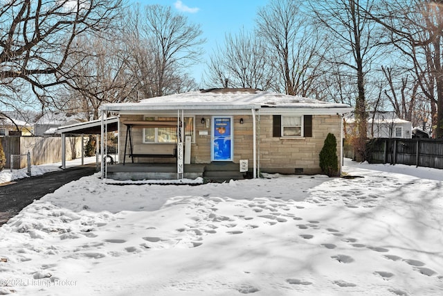 view of front of property featuring a porch, stone siding, and fence