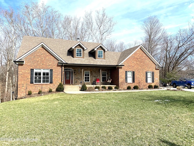 view of front of home with stone siding, brick siding, and a front yard