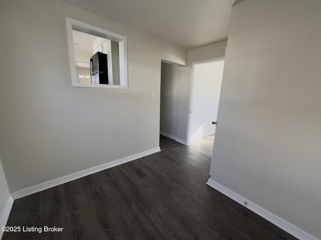 corridor featuring dark hardwood / wood-style floors