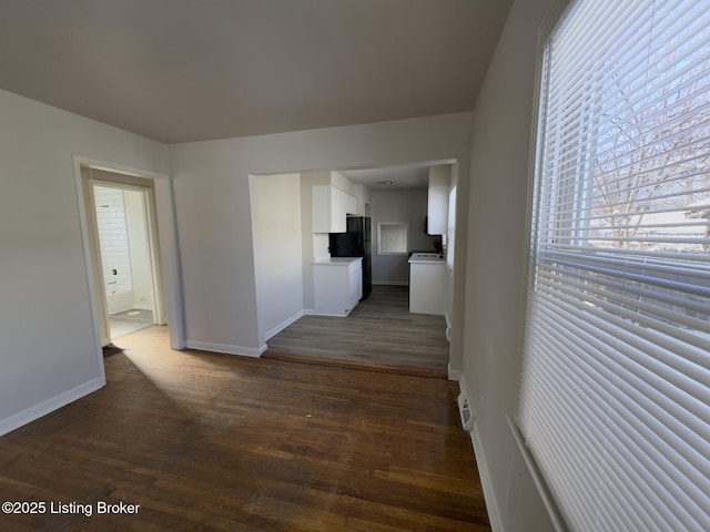 hall with dark hardwood / wood-style floors