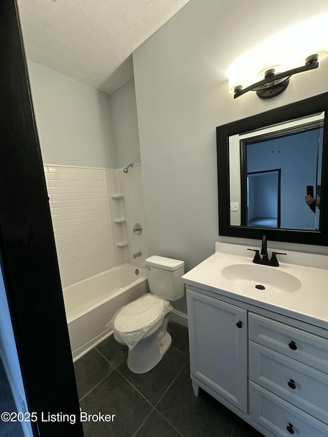 full bathroom with toilet, vanity, a textured ceiling,  shower combination, and tile patterned floors