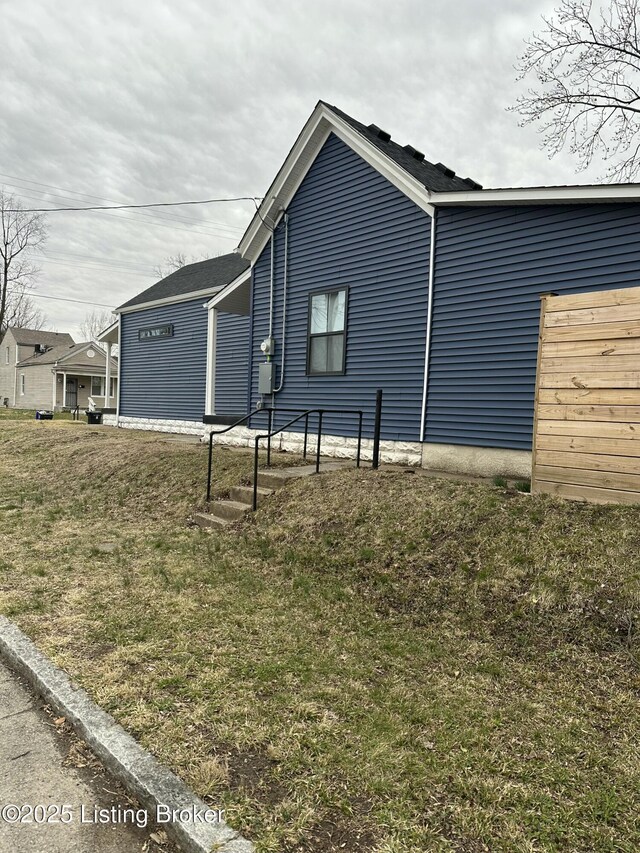 view of home's exterior featuring a yard