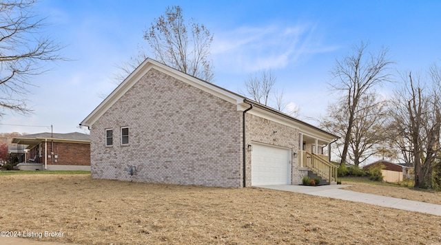 view of property exterior featuring a garage and a yard