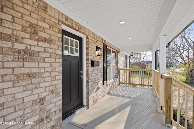 doorway to property with covered porch