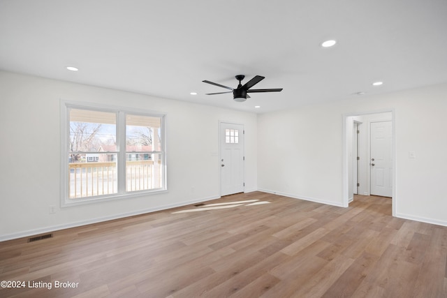 interior space with ceiling fan and light hardwood / wood-style flooring