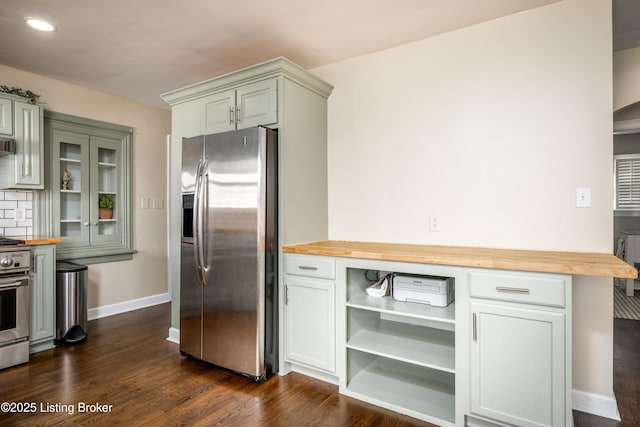 kitchen with stainless steel refrigerator with ice dispenser, dark hardwood / wood-style flooring, butcher block countertops, and stove