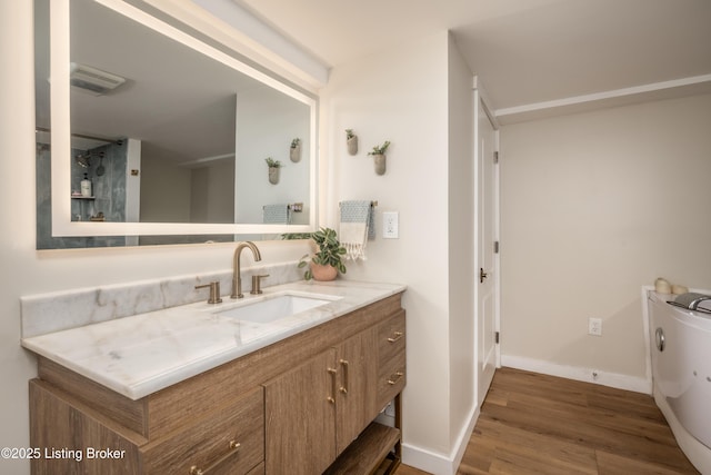 bathroom with vanity and hardwood / wood-style flooring