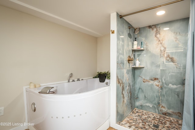 bathroom featuring a tile shower