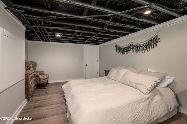 bedroom with hardwood / wood-style floors