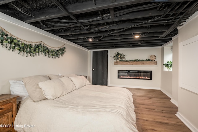 bedroom featuring hardwood / wood-style flooring