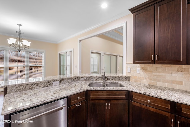 kitchen with stainless steel dishwasher, sink, tasteful backsplash, and light stone countertops